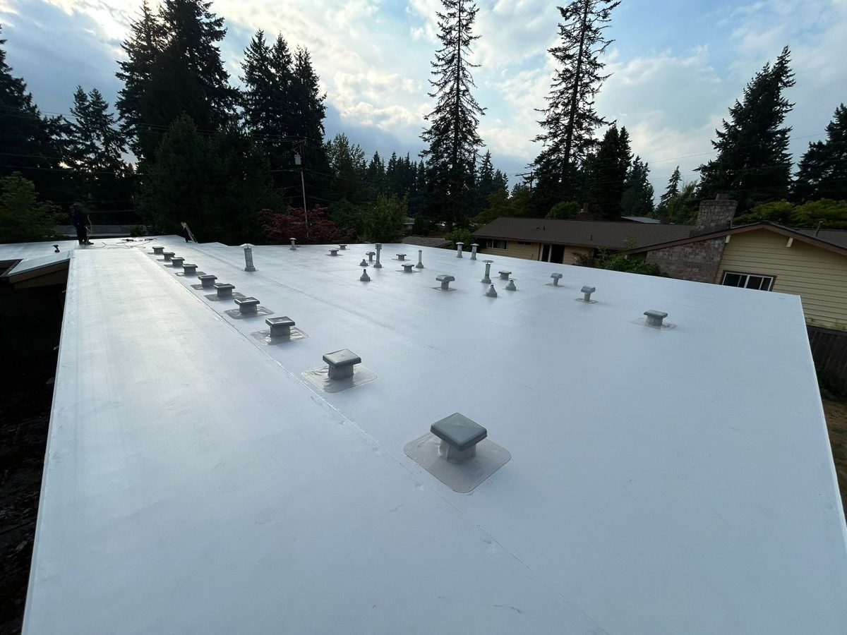 PVC flat roof installation - residential neighborhood